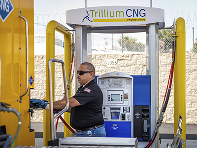 professional driver fueling at Trillium CNG station
