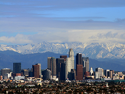 LA skyline in front of mountains by Todd Jones Photography