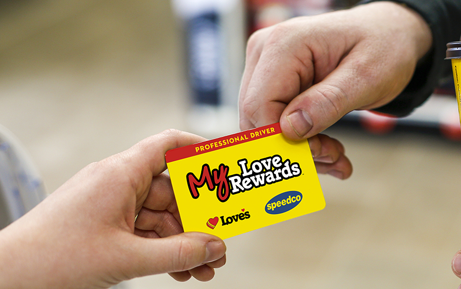 MLR card being handed from a customer to a cashier with a Love's Coffee cup